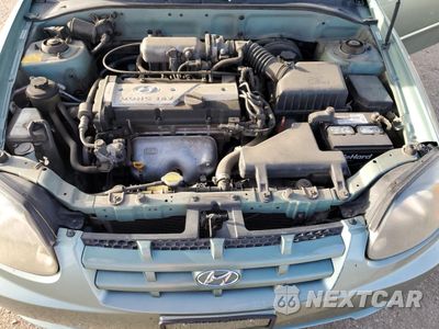 Zdjęcie 11 z 14 samochodu: 2004 HYUNDAI ACCENT GL VIN:KMHCG35C14U308396 - miniatura