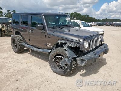 Czwarte zdjęcie samochodu z boku: 2017 JEEP WRANGLER UNLIMITED SAHARA VIN:1C4HJWEG8HL596364 - miniatura