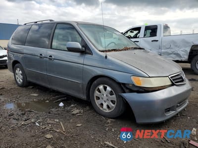 Czwarte zdjęcie samochodu z boku: 2002 HONDA ODYSSEY EXL VIN:5FNRL18982B031377 - miniatura