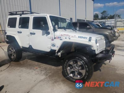 Czwarte zdjęcie samochodu z boku: 2016 JEEP WRANGLER UNLIMITED SAHARA VIN:1C4BJWEG2GL304390 - miniatura