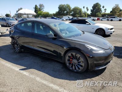 Czwarte zdjęcie samochodu z boku: 2023 TESLA MODEL 3 VIN:5YJ3E1EC3PF627794 - miniatura