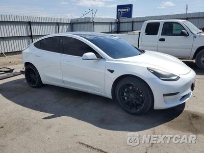 Czwarte zdjęcie samochodu z boku: 2017 TESLA MODEL 3 VIN:5YJ3E1EA4HF002613 - miniatura