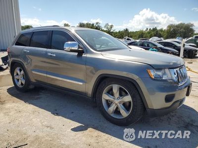 Czwarte zdjęcie samochodu z boku: 2013 JEEP GRAND CHEROKEE OVERLAND VIN:1C4RJFCT1DC545416 - miniatura