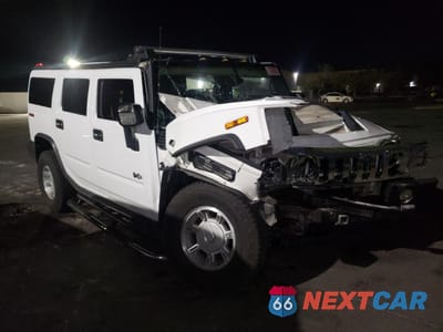 Czwarte zdjęcie samochodu z boku: 2005 HUMMER H2 VIN:5GRGN23U75H126339 - miniatura