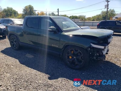 Czwarte zdjęcie samochodu z boku: 2022 RIVIAN R1T ADVENTURE VIN:7FCTGAAA3NN012699 - miniatura