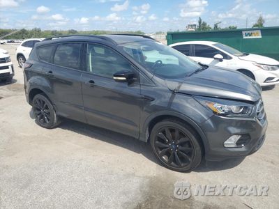 Czwarte zdjęcie samochodu z boku: 2017 FORD ESCAPE TITANIUM VIN:1FMCU0J98HUC37365 - miniatura