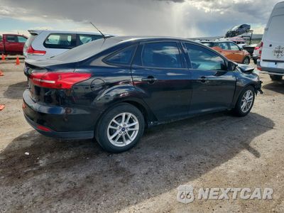 Trzecie zdjęcie samochodu z tyłu: 2016 FORD FOCUS SE VIN:1FADP3F26GL405219 - miniatura