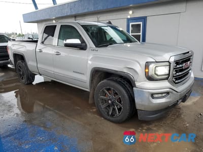 Czwarte zdjęcie samochodu z boku: 2016 GMC SIERRA K1500 SLT VIN:1GTV2NEJ9GZ396479 - miniatura