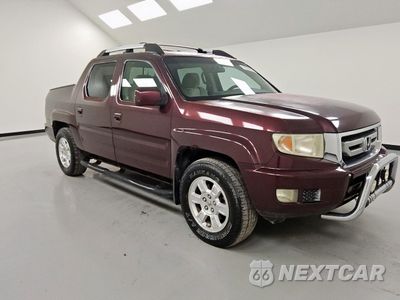 Czwarte zdjęcie samochodu z boku: 2011 HONDA RIDGELINE RTS VIN:5FPYK1F47BB006354 - miniatura