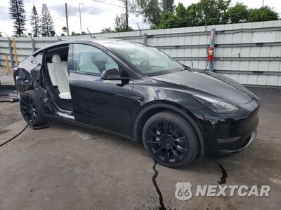 Czwarte zdjęcie samochodu z boku: 2024 TESLA MODEL Y VIN:7SAYGDEEXRA220836 - miniatura