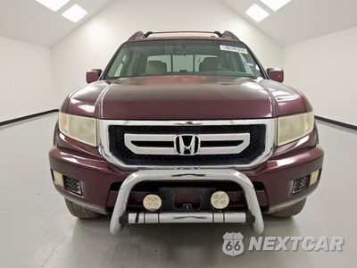 Piąte zdjęcie samochodu w środku: 2011 HONDA RIDGELINE RTS VIN:5FPYK1F47BB006354 - miniatura