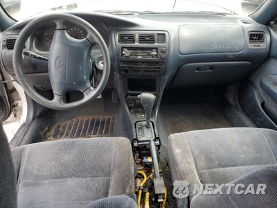 Zdjęcie 8 z 14 samochodu: 1994 TOYOTA COROLLA LE VIN:1NXAE09B7RZ196711 - miniatura