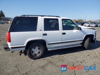 Trzecie zdjęcie samochodu z tyłu: 1999 CHEVROLET TAHOE K1500 VIN:1GNEK13R7XR106555 - miniatura
