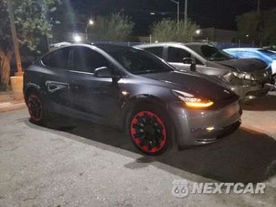 Czwarte zdjęcie samochodu z boku: 2021 TESLA MODEL Y VIN:5YJYGDEEXMF207884 - miniatura