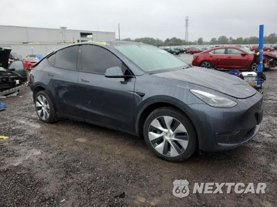 Czwarte zdjęcie samochodu z boku: 2023 TESLA MODEL Y VIN:7SAYGDEE3PF605171 - miniatura