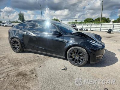 Czwarte zdjęcie samochodu z boku: 2021 TESLA MODEL Y VIN:5YJYGDEE0MF076576 - miniatura