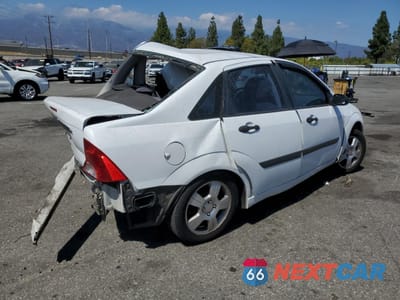 Trzecie zdjęcie samochodu z tyłu: 2001 FORD FOCUS LX VIN:1FAFP33PX1W294849 - miniatura