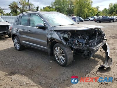 Czwarte zdjęcie samochodu z boku: 2014 VOLKSWAGEN TIGUAN S VIN:WVGBV3AX3EW594879 - miniatura