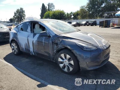 Czwarte zdjęcie samochodu z boku: 2023 TESLA MODEL Y VIN:7SAYGAEE5PF812336 - miniatura