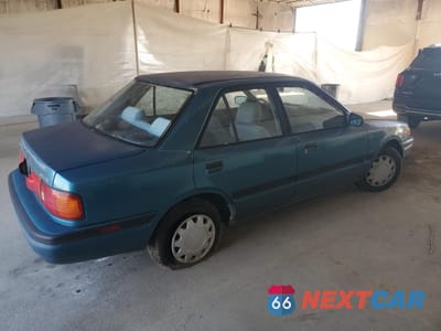 Trzecie zdjęcie samochodu z tyłu: 1994 MAZDA PROTEGE DX VIN:JM1BG2248R0778768 - miniatura