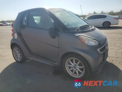 Czwarte zdjęcie samochodu z boku: 2016 SMART FORTWO VIN:WMEEJ9AA7GK845619 - miniatura