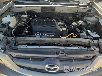 Zdjęcie 12 z 13 samochodu: 2003 MAZDA TRIBUTE LX VIN:4F2YZ94183KM07475 - miniatura