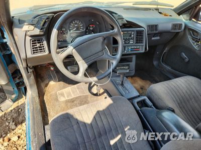 Zdjęcie 8 z 14 samochodu: 1994 PONTIAC SUNBIRD LE VIN:1G2JB14T4R7546107 - miniatura
