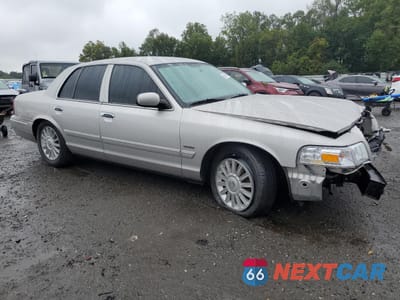 Czwarte zdjęcie samochodu z boku: 2010 MERCURY GRAND MARQUIS LS VIN:2MEBM7FV3AX630962 - miniatura