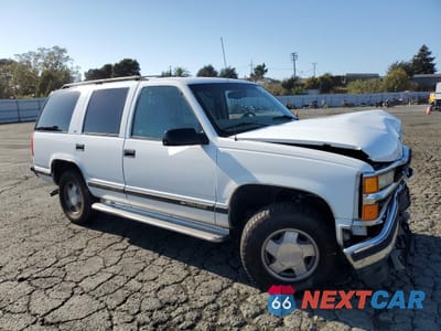 Czwarte zdjęcie samochodu z boku: 1999 CHEVROLET TAHOE K1500 VIN:1GNEK13R7XR106555 - miniatura