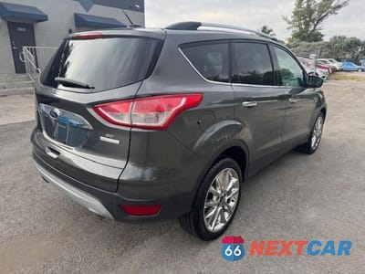 Trzecie zdjęcie samochodu z tyłu: 2016 FORD ESCAPE SE VIN:1FMCU0GX4GUC35892 - miniatura