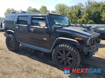 Czwarte zdjęcie samochodu z boku: 2005 HUMMER H2 VIN:5GRGN23U25H116950 - miniatura