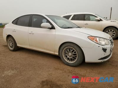 Czwarte zdjęcie samochodu z boku: 2010 HYUNDAI ELANTRA BLUE VIN:KMHDU4BD8AU027210 - miniatura