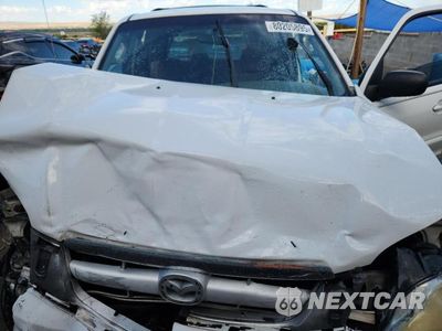 Zdjęcie 12 z 13 samochodu: 2002 MAZDA TRIBUTE VIN:4F2YU09102KM51326 - miniatura