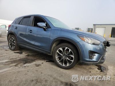 Czwarte zdjęcie samochodu z boku: 2016 MAZDA CX-5 GT VIN:JM3KE4DY0G0692263 - miniatura