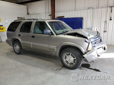 Czwarte zdjęcie samochodu z boku: 1999 GMC JIMMY VIN:1GKDT13W6X2514954 - miniatura