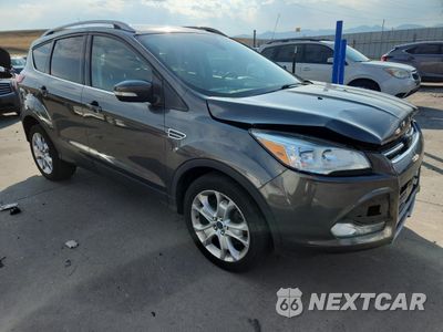 Czwarte zdjęcie samochodu z boku: 2015 FORD ESCAPE TITANIUM VIN:1FMCU9J9XFUB94388 - miniatura