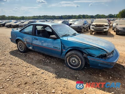 Czwarte zdjęcie samochodu z boku: 1994 PONTIAC SUNBIRD LE VIN:1G2JB14T4R7546107 - miniatura