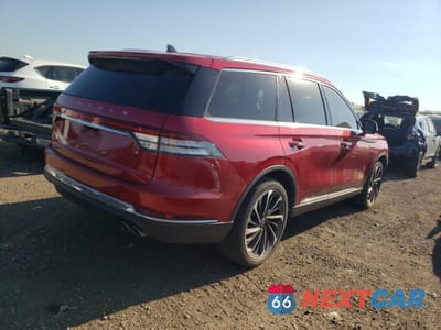 Trzecie zdjęcie samochodu z tyłu: 2021 LINCOLN AVIATOR RESERVE VIN:5LM5J7XC9MGL09404 - miniatura