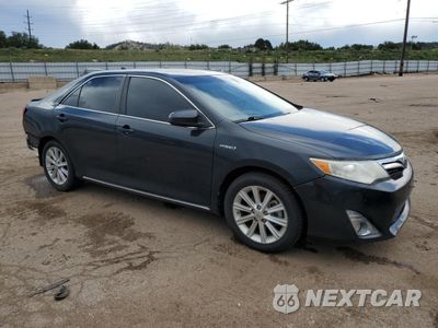 Czwarte zdjęcie samochodu z boku: 2012 TOYOTA CAMRY HYBRID VIN:4T1BD1FKXCU038081 - miniatura