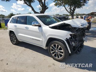 Czwarte zdjęcie samochodu z boku: 2018 JEEP GRAND CHEROKEE OVERLAND VIN:1C4RJECG1JC204994 - miniatura
