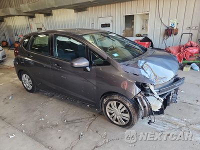 Czwarte zdjęcie samochodu z boku: 2016 HONDA FIT LX VIN:JHMGK5H5XGS014989 - miniatura