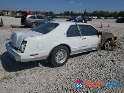 Trzecie zdjęcie samochodu z tyłu: 1986 LINCOLN MARK VII VIN:1LNBP98F1GY722599 - miniatura