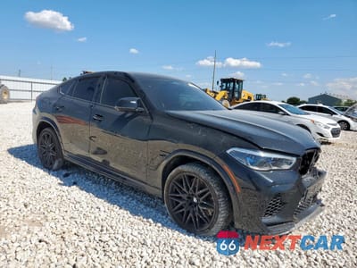 Czwarte zdjęcie samochodu z boku: 2021 BMW X6 M VIN:5YMCY0C09M9E09840 - miniatura