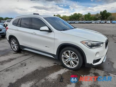Czwarte zdjęcie samochodu z boku: 2016 BMW X1 XDRIVE28I VIN:WBXHT3C36G5E47257 - miniatura