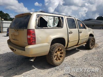 Trzecie zdjęcie samochodu z tyłu: 2010 CHEVROLET SUBURBAN K1500 LS VIN:1GNUKHE35AR159419 - miniatura