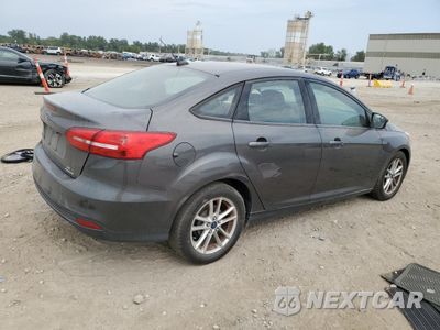 Trzecie zdjęcie samochodu z tyłu: 2016 FORD FOCUS SE VIN:1FADP3F28GL212442 - miniatura