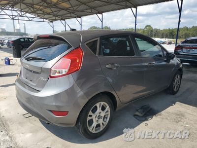 Trzecie zdjęcie samochodu z tyłu: 2014 FORD FIESTA SE VIN:3FADP4EJ1EM102651 - miniatura