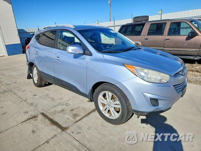 Czwarte zdjęcie samochodu z boku: 2011 HYUNDAI TUCSON GLS VIN:KM8JUCAC0BU158381 - miniatura