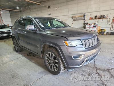 Czwarte zdjęcie samochodu z boku: 2017 JEEP GRAND CHEROKEE OVERLAND VIN:1C4RJFCT8HC854208 - miniatura