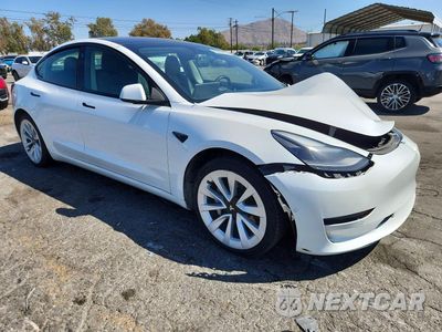 Czwarte zdjęcie samochodu z boku: 2022 TESLA MODEL 3 VIN:5YJ3E1EB6NF265450 - miniatura